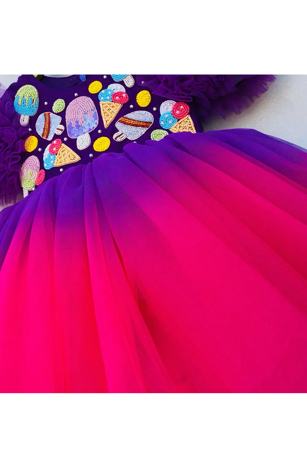 Magenta and blue icecream and candies embroidered high low gown