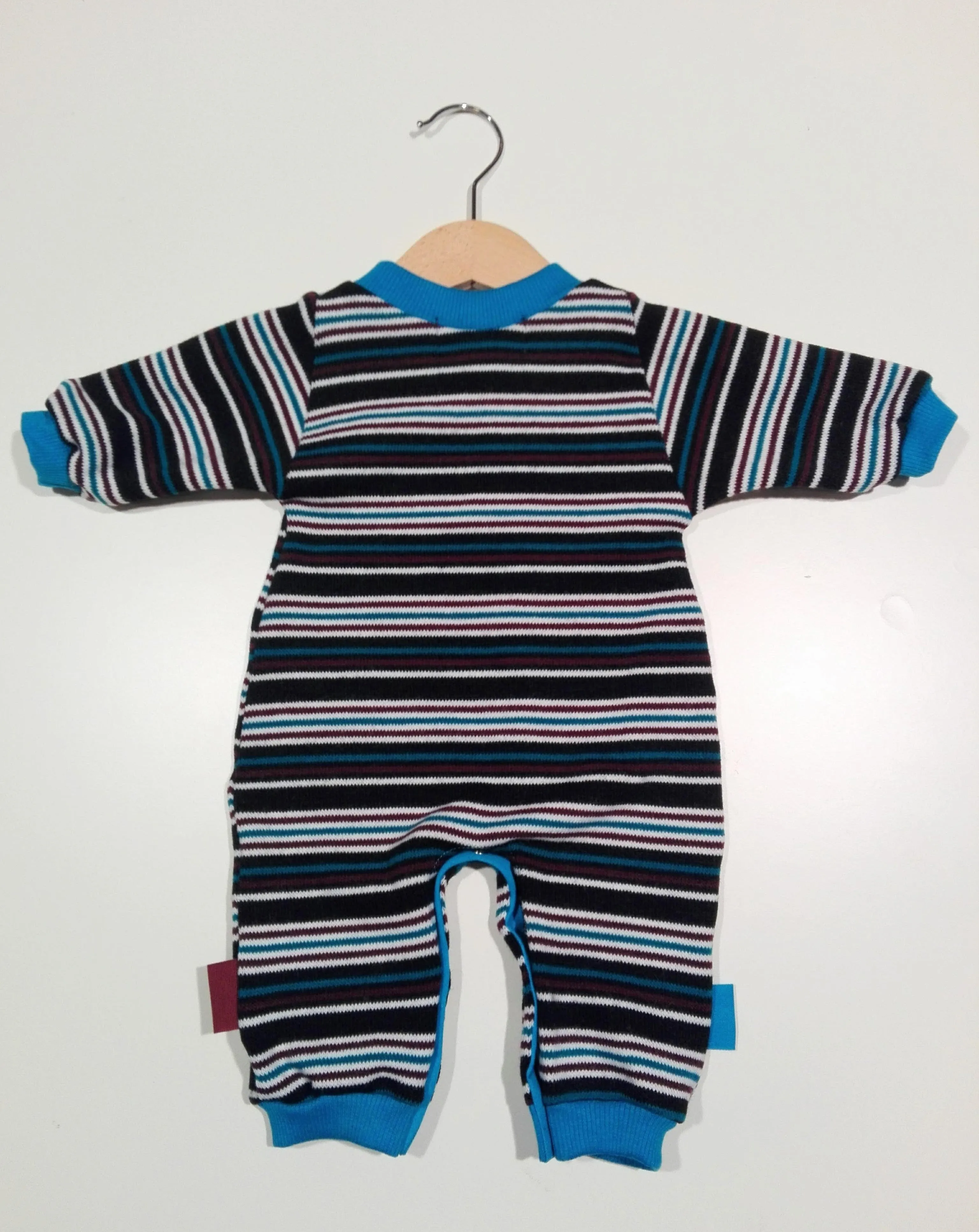 Onesie in wool with cuffs in cotton