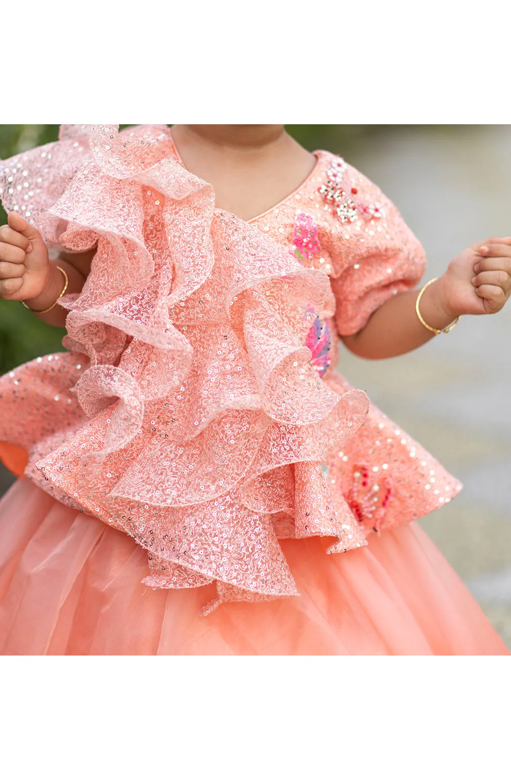 Peach ruffle sequins peplum style top with lehenga