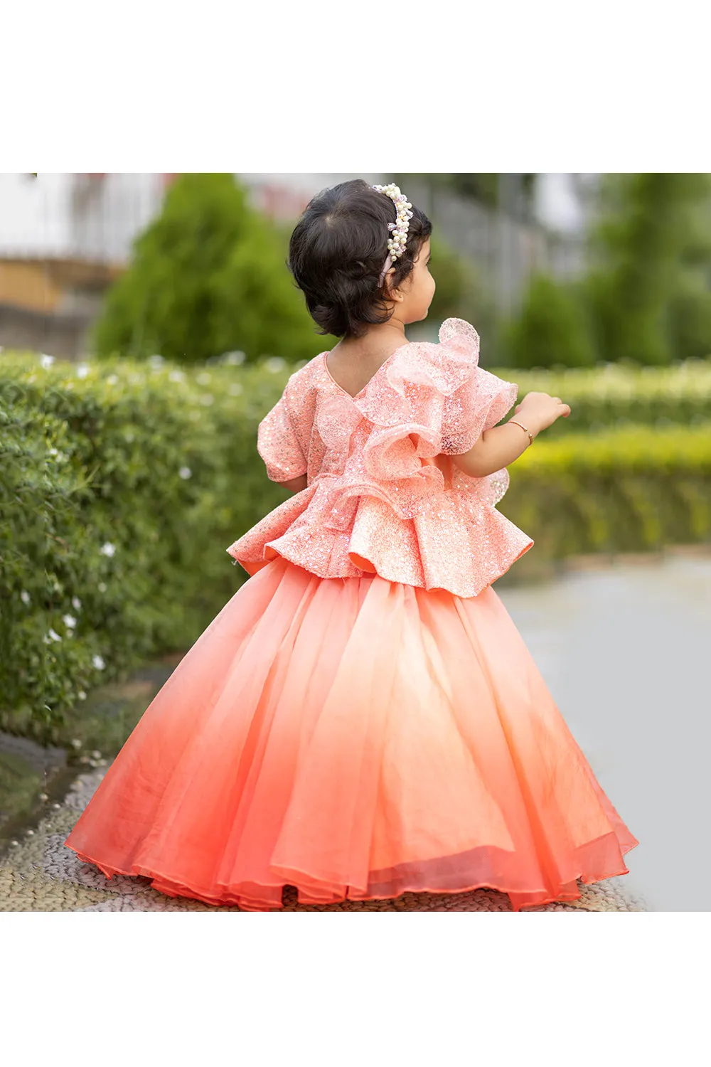 Peach ruffle sequins peplum style top with lehenga