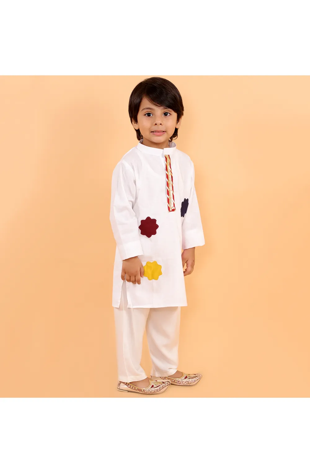 White holi kurta with colorful patches and gota and white pyjama