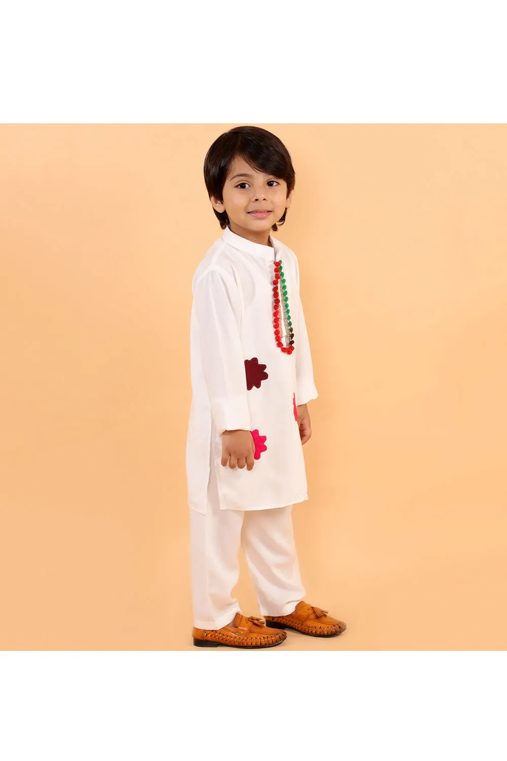 White holi kurta with colorful patches and white pyjama