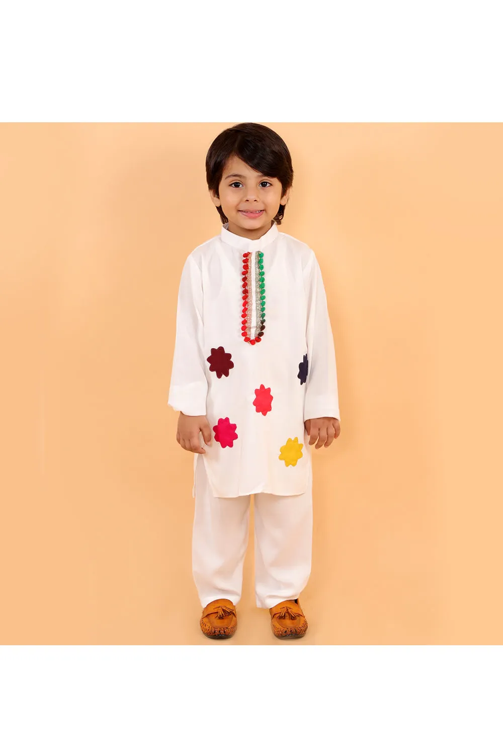 White holi kurta with colorful patches and white pyjama