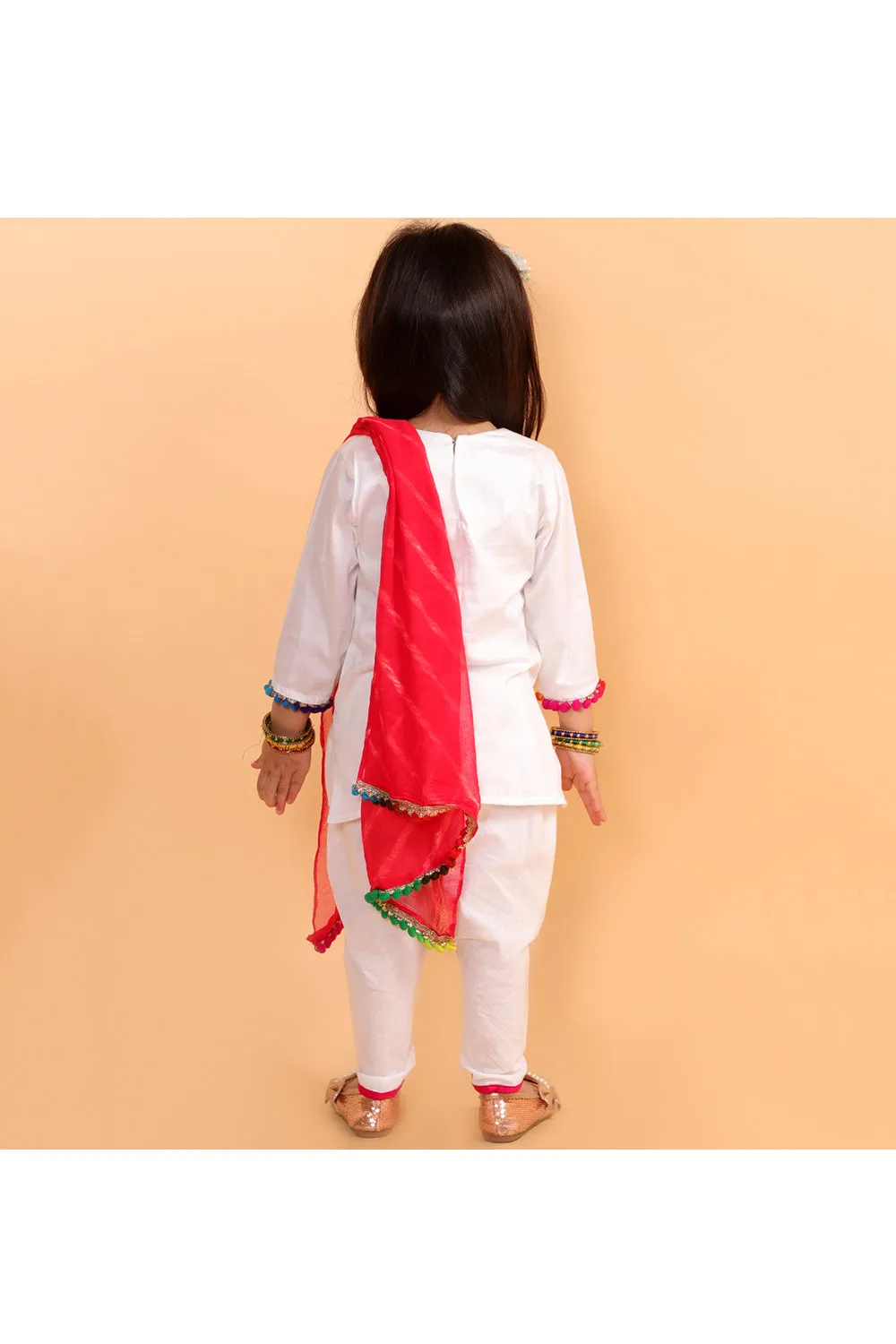 White kurta with colorful patches and dhoti with colorful dupatta